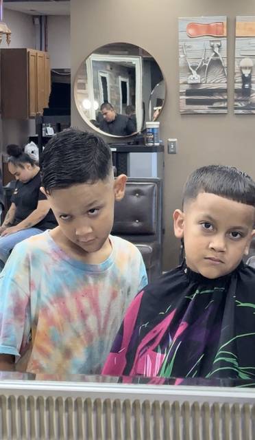 Two brothers with matching cuts