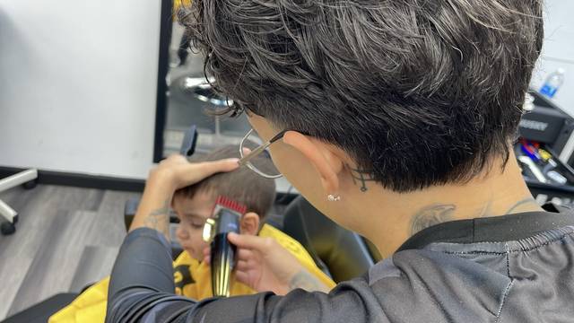 Combing through a kid's fresh cut