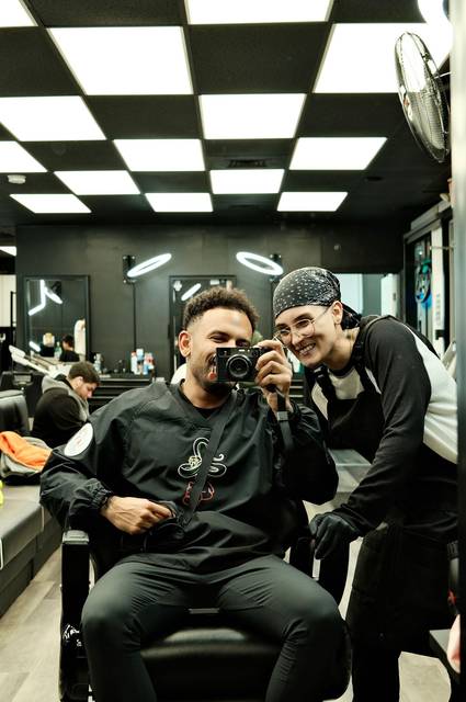 Steph and a client in the mirror