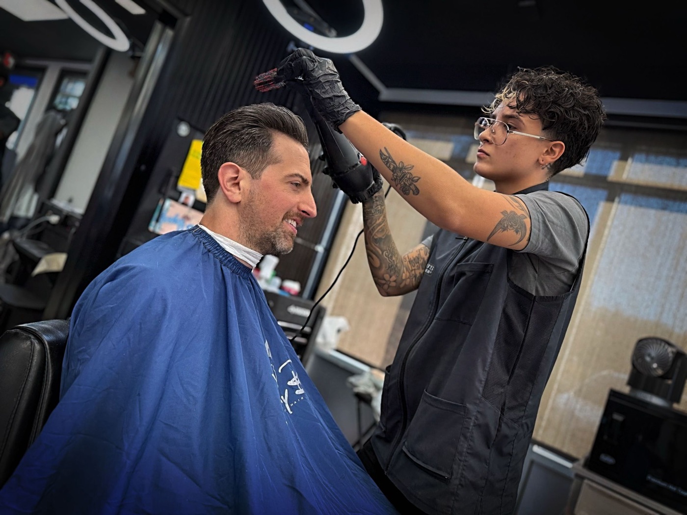 Steph styling a client's hair in the studio
